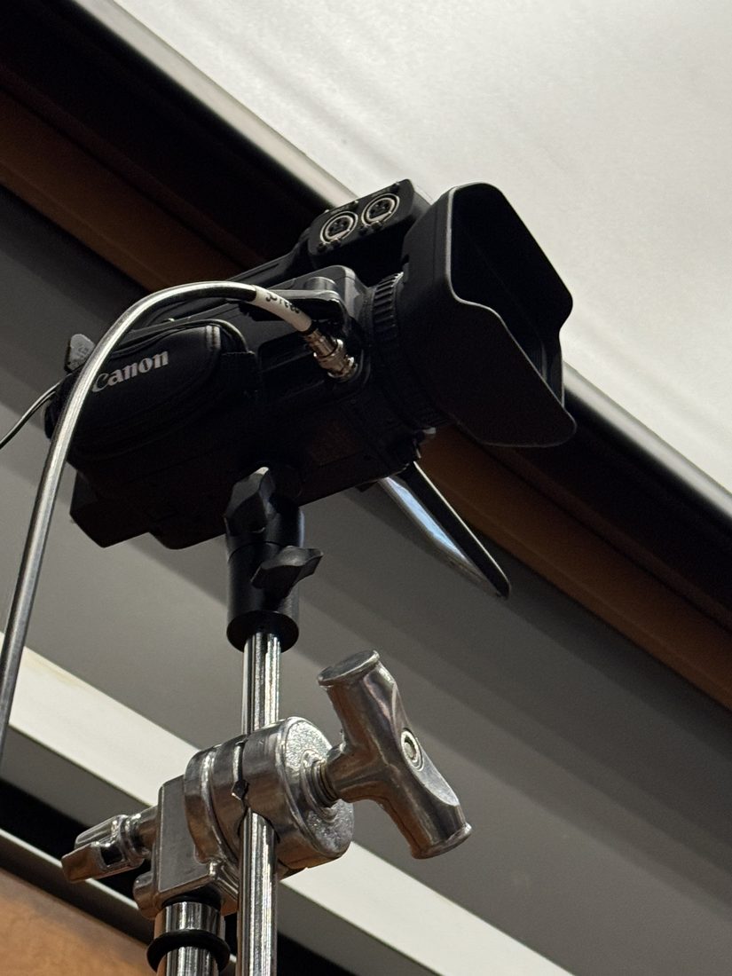 A broadcast camera on a stand covering the competition