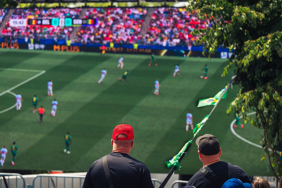 A scout watching a game from the stands