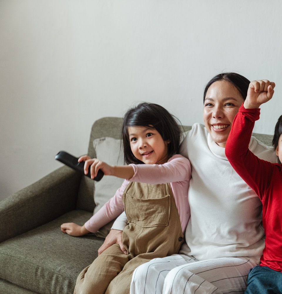 A mother and daughter watching together at home