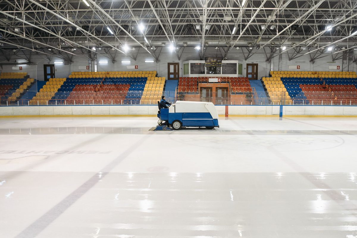 An ice resurfacer at a rink between sessions